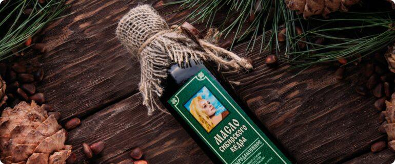 A bottle of siberian pine nut oil on wood